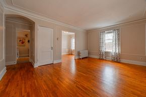 St. Paul apartment for rent - A room with wooden floors and white walls.