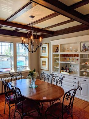 St. Paul apartment for rent - A dining room with a wooden table and chairs.