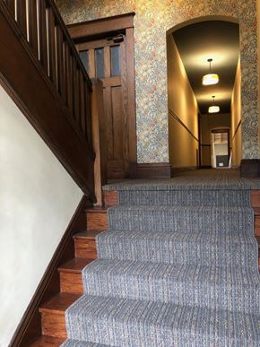 St. Paul apartment for rent - A staircase with a carpeted runner and wooden steps.