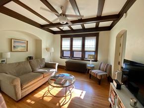 St. Paul apartment for rent - A living room with a couch, chair, and coffee table.
