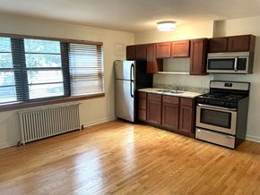 St. Paul apartment for rent - A kitchen with wooden floors and stainless steel appliances.