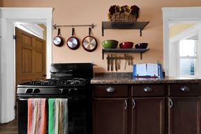 St. Paul apartment for rent - A kitchen with a black stove and wooden cabinets.