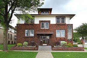 Saint Paul apartment for rent - A brick building with a white roof and a sign that says "FISH".