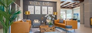 Miami apartment for rent - A living room with a couch, chairs, and a coffee table in front of a wall with the text "VISTA LAGO".
