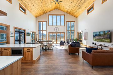 Fraser apartment for rent - A spacious kitchen and living room with wooden floors and a large window.