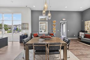 Lake Charles apartment for rent - A modern dining room with a wooden table and chairs.