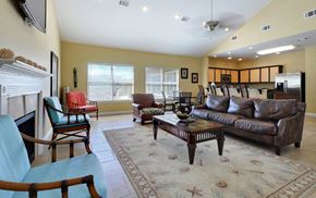 Long Beach apartment for rent - A living room with a fireplace and a blue chair.