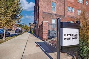 Evansville apartment for rent - A sign that says Maybelle Montrose in front of a brick building.