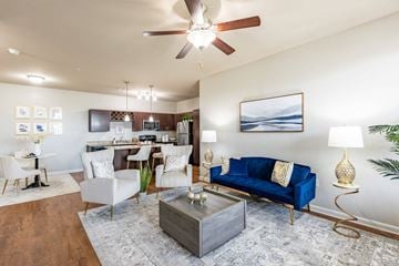 Lake Charles apartment for rent - A living room with a blue couch and a wooden coffee table.