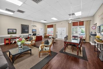 North Charleston apartment for rent - A living room with a dining table and chairs.
