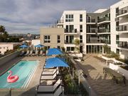 Los Angeles apartment for rent - A pool with a pink flamingo float sits in the middle of a patio area.