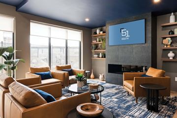 White Plains apartment for rent - A living room with a blue carpet and a fireplace.