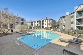 Austin apartment for rent - A pool surrounded by apartment buildings and a sun lounger.at Onyx183, Austin  