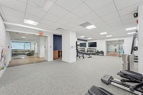 Alexandria apartment for rent - A gym with a variety of equipment including treadmills, weights and exercise machines at Sherwood at Southern Towers, Alexandria, 22311