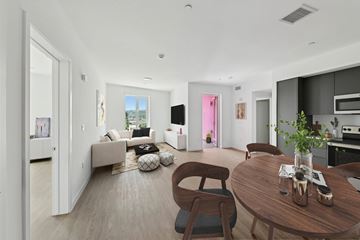 Los Angeles apartment for rent - A modern living room with a brown wooden table and chairs.