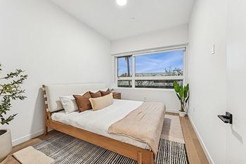 Bedroom with a bed and oversized window