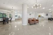 Alexandria apartment for rent - A Spacious Lobby With a Chandelier at Ashlawn at Southern Towers, Alexandria, VA, 22311