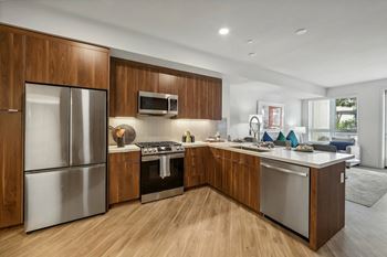 Kitchen with wooden cabinetry and refrigerator