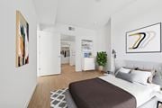 Los Angeles apartment for rent - A bedroom with a large bed and a painting on the wall at Coro Apartments, Los Angeles