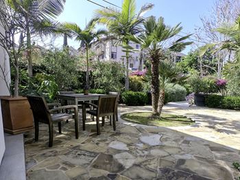 Patio with a table surrounded by chairs