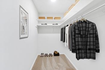 Walk-in closet with clothes