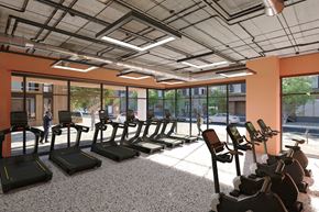 Boston apartment for rent - A gym with treadmills and a person walking by.