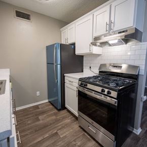 Waco apartment for rent - A kitchen with a stove, oven, and refrigerator.