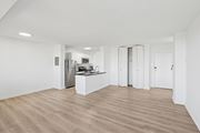 Alexandria apartment for rent - A kitchen area with a refrigerator, microwave, and oven.