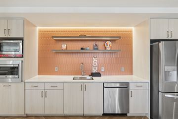 Alexandria apartment for rent - A kitchen with a sink and a refrigerator.
