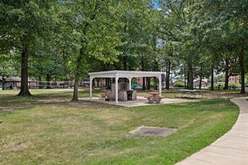 Alexandria apartment for rent - A pavilion in a park with a picnic table and chairs.