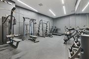 Los Angeles apartment for rent - A gym with a variety of equipment including treadmills, weights, and benches.