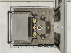 Newton apartment for rent - A top view of a dining area with a table, chairs, and a hanging cloth, 28 Austin, Newton, Massachusetts