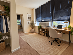 Reading apartment for rent - A room with a desk, chair, and a window with blinds.