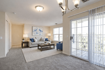 Blandon apartment for rent - A well-lit living room with a sofa, coffee table, and a painting on the wall.