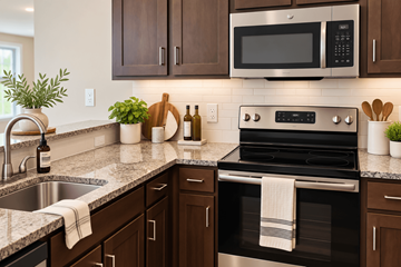 Allentown apartment for rent - A modern kitchen with dark brown cabinets and a black stove top oven.