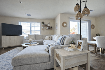 Allentown apartment for rent - A living room with a grey couch and a wooden coffee table.