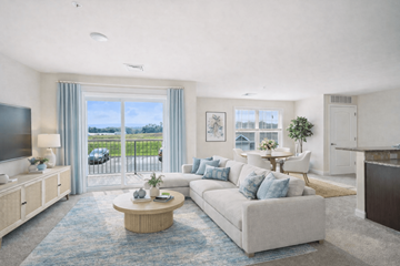 Wyomissing apartment for rent - A living room with a white couch and a television.