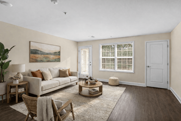 Easton apartment for rent - A living room with a couch, chairs, and a painting on the wall.