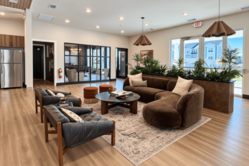 Gettysburg apartment for rent - A living room with brown furniture and a large window.