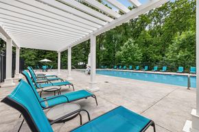 Gaithersburg apartment for rent - A row of blue chairs are lined up under a white canopy.