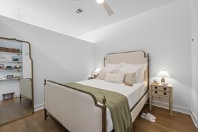 Germantown apartment for rent - A bedroom with a bed, nightstand, and a mirror.