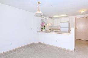 Seattle apartment for rent - A room with a white wall and a brown door.
