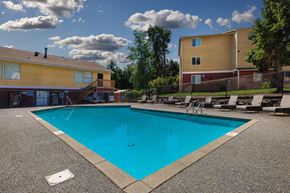 Lynnwood apartment for rent - A swimming pool surrounded by a concrete floor and a fence.