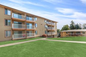 Federal Way apartment for rent - A large grassy area in front of apartment buildings.