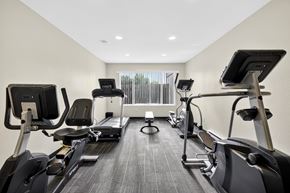 Seatac apartment for rent - A spacious gym with treadmills and elliptical machines.