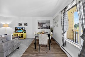Lynnwood apartment for rent - A dining room with a table set for two and a couch.