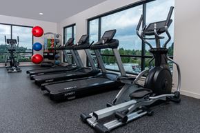 Seatac apartment for rent - A gym with treadmills, exercise balls, and weights.