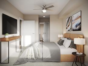 Seatac apartment for rent - A modern bedroom with a large bed and a ceiling fan.