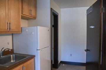 Seattle apartment for rent - A kitchen with a sink and a refrigerator.