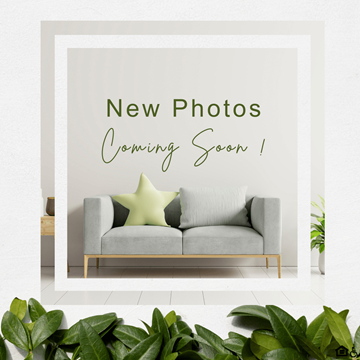Kent apartment for rent - A poster with the text "New Photos Coming Soon !" is displayed on a wall above a grey sofa.